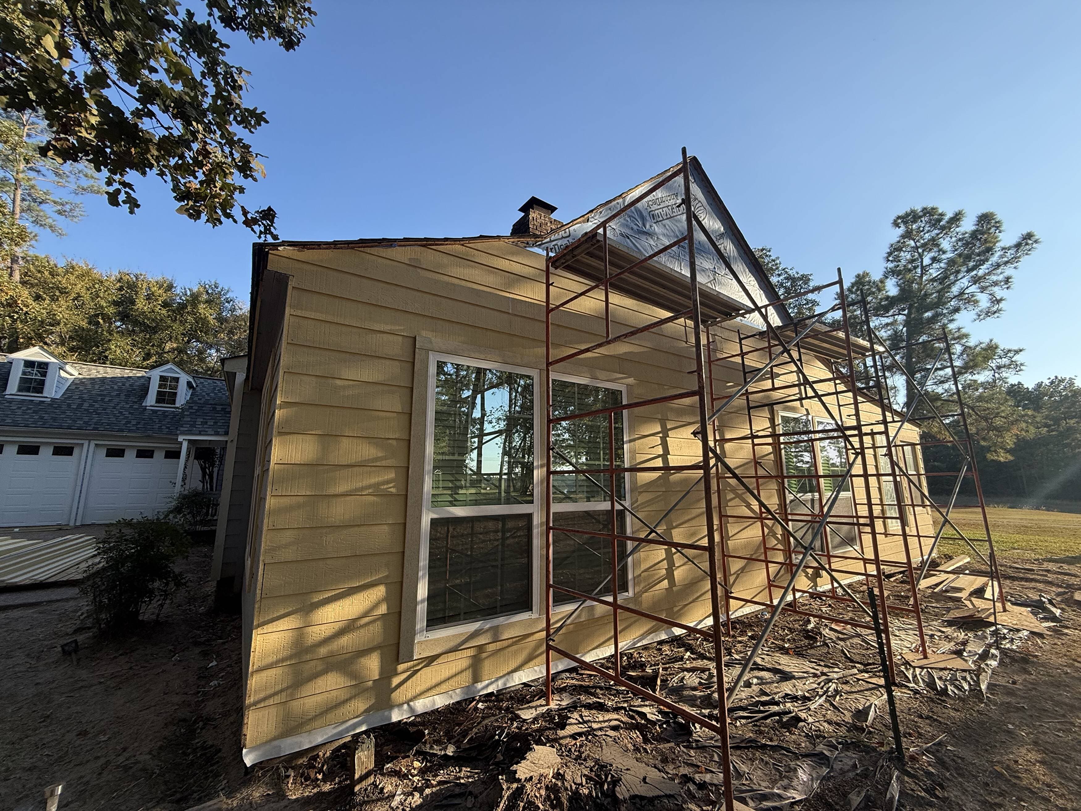 Exterior renovation in progress showing newly installed siding on a Montgomery County home